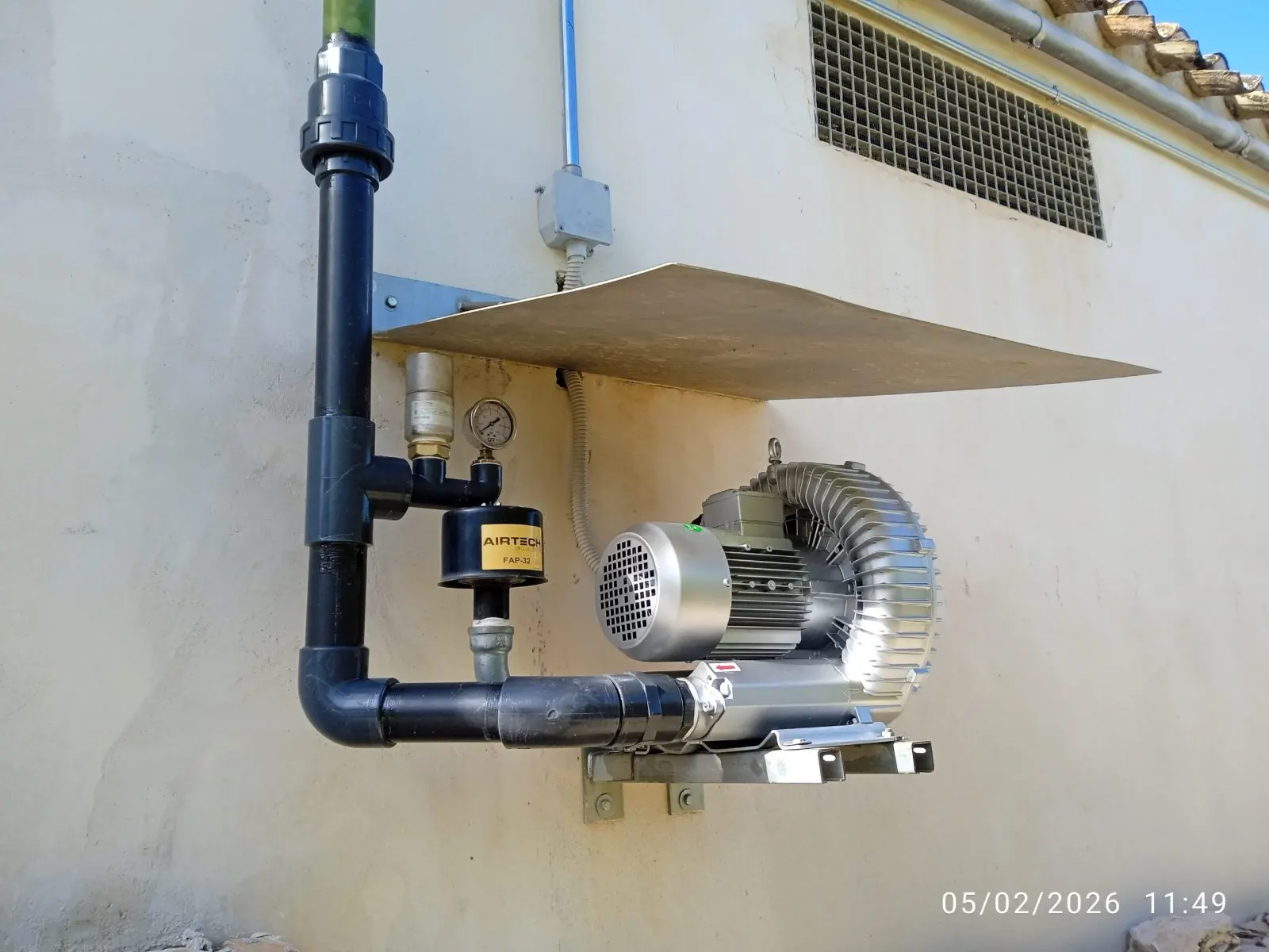 Water pressure set mounted on the wall with pipework and valves