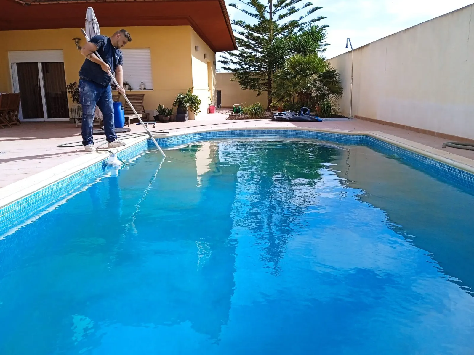 The same pool with clear water after treatment and a proper service